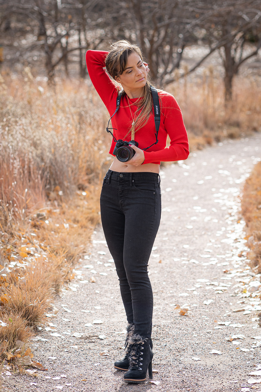 woman holding camera outside