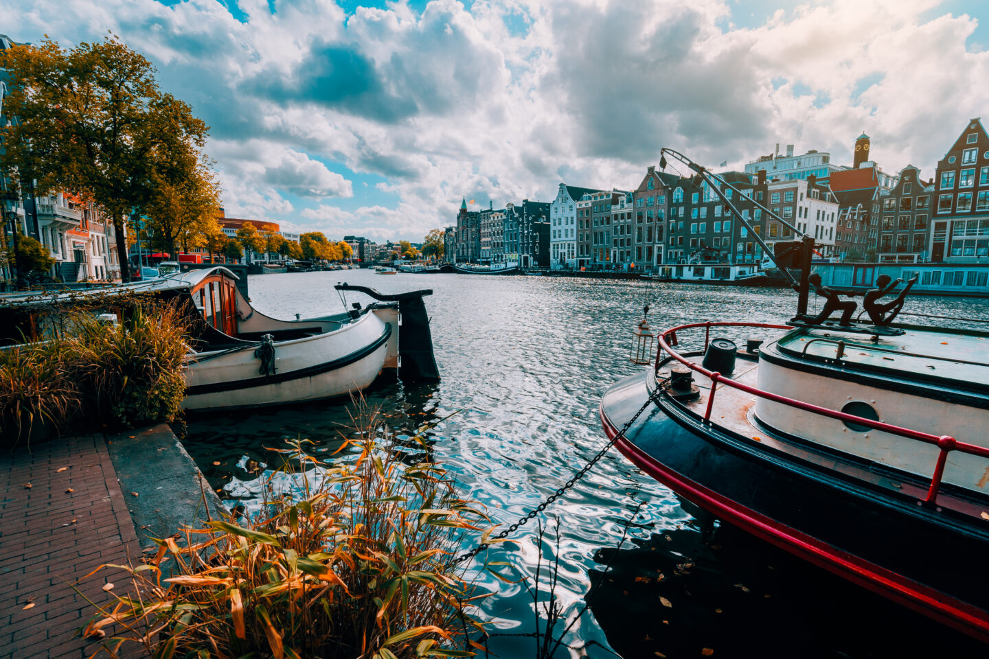 Amsterdam canal Singel with typical dutch houses and houseboats 