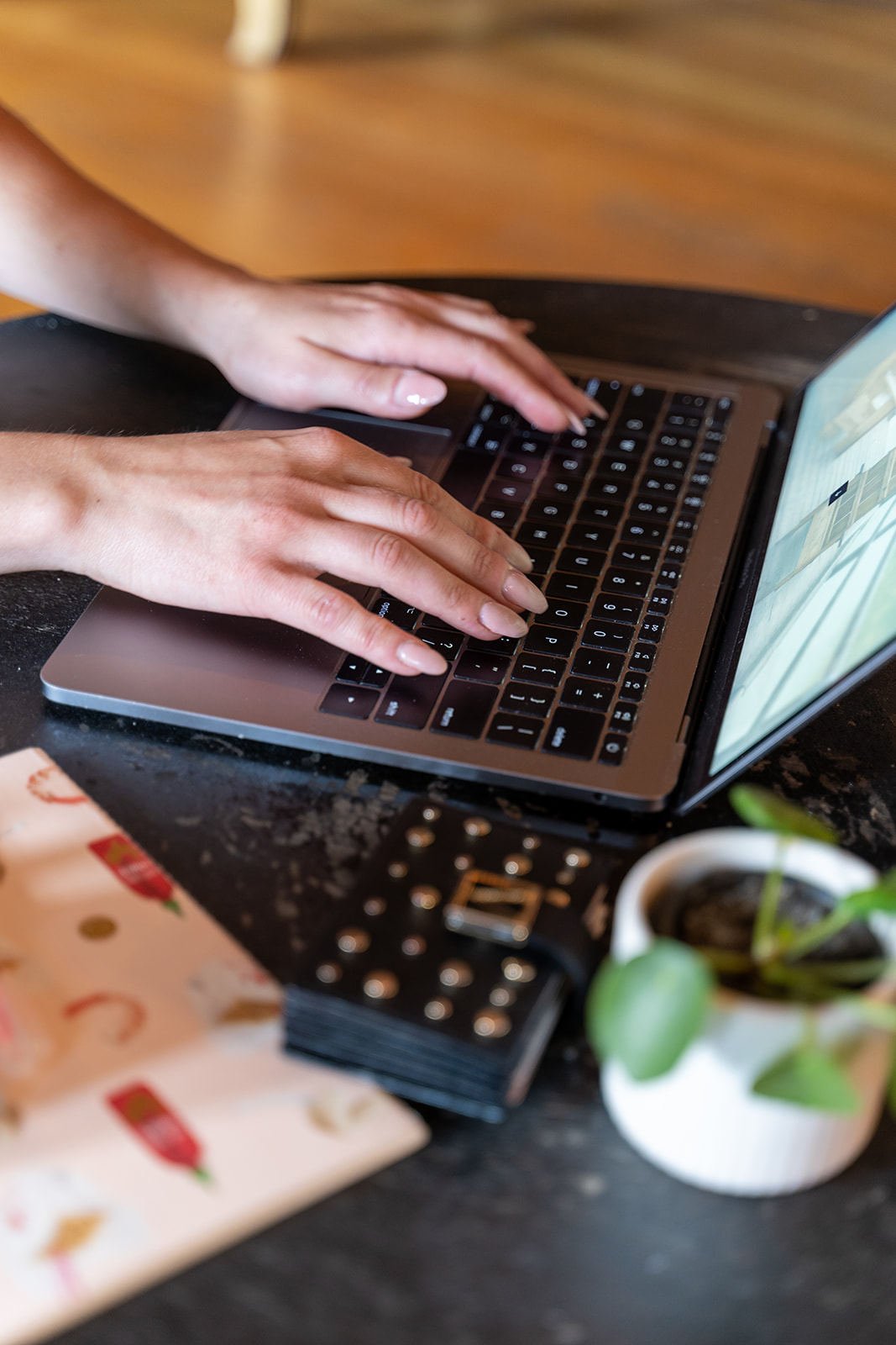Woman's hands on a laptop computer